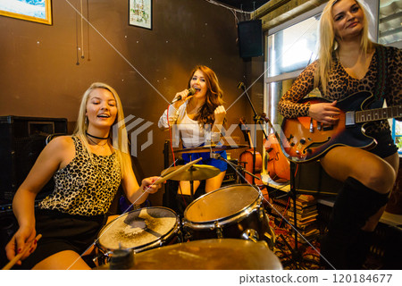 Woman singing, band playing instruments. Woman singing, band playing instruments. 120184677