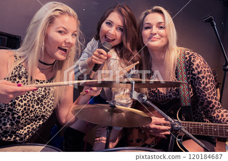 Music band performing on stage. 120184687