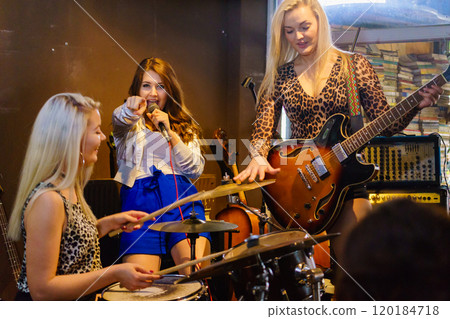 Woman singing, band playing instruments. Woman singing, band playing instruments. 120184718
