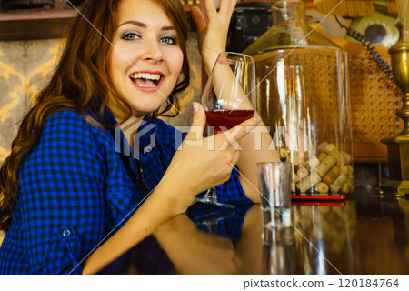 Girl with alcohol glass in pub club Girl with alcohol glass in pub club 120184764