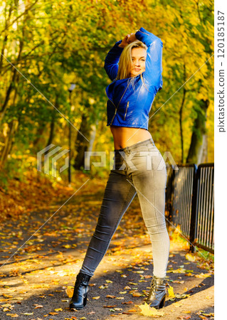 Fashion woman walking in autumn park Fashion woman walking in autumn park 120185187