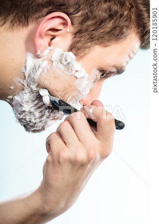 Man shaving with razor face profile 120185901