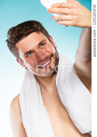 Happy half shaved man taking selfie self photo. 120185916