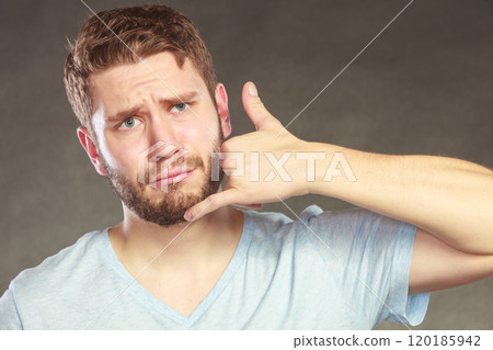 Man showing call me gesture. 120185942