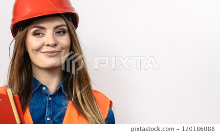 Woman engineer construction builder in helmet. 120186088