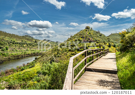 Walking along the Barca da Amieira walkways in Amieira do Tejo, Portugal. Walking along the Barca da Amieira walkways in Amieira do Tejo, Portugal. 120187011