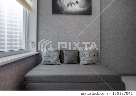 Master bedroom with sliding wardrobe and balcony door. Elegant and comfortable hotel bedroom interior Master bedroom with sliding wardrobe and balcony door. Elegant and comfortable hotel bedroom interior 120187041