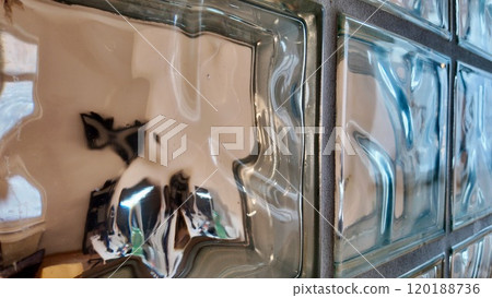 Textured Glass Blocks Creating a Distorted Indoor Reflection 120188736