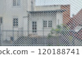 View of a Residential Area Through a Mesh Screen on a Cloudy Day 120188741