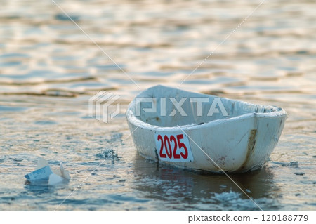 White boat 2025 floating on water White boat 2025 floating on water 120188779