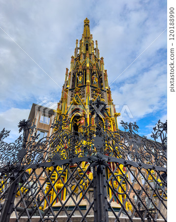 Schoner Brunnen ancient fountain and Frauenkirche Church at Hauptmarkt main square 120188990
