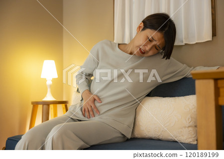 A young woman is surprised at her smartphone at night A young woman is surprised at her smartphone at night 120189199