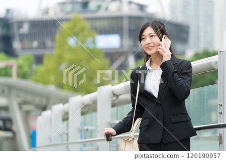 Business woman who is calling on smartphone 120190957