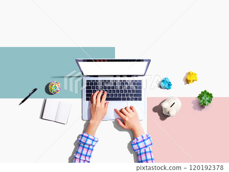 Laptop computer with a piggy bank and office objects Laptop computer with a piggy bank and office objects 120192378