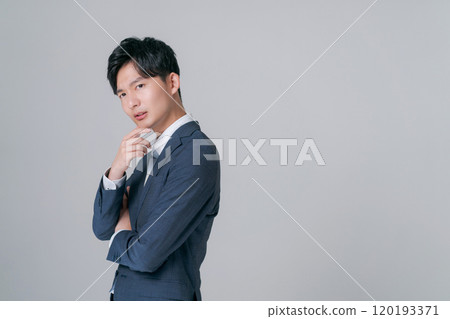 A thoughtful young businessman A thoughtful young businessman 120193371