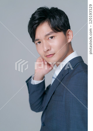 young man wearing a suit 120193529