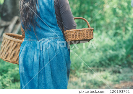 Woman with woven basket 120193761