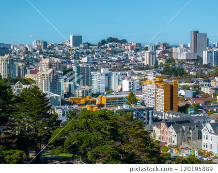 The image captures San Francisco's cityscape, featuring the Painted Ladies and Alamo Square Park, with modern buildings in the background under a clear sky. 120195889