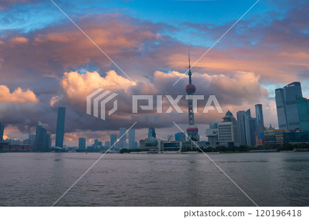 View of Shanghai's skyline featuring the Oriental Pearl Tower, modern skyscrapers, and historic architecture with the Huangpu River in the foreground. View of Shanghai's skyline featuring the Oriental Pearl Tower, modern skyscrapers, and historic architecture with the Huangpu River in the foreground. 120196418