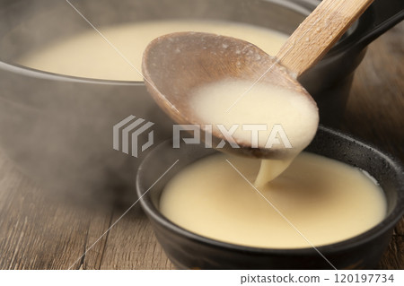 Amazake: Pour warm amazake into a teacup 120197734