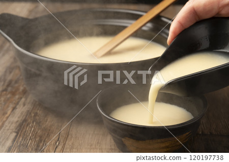 Amazake: Pour warm amazake into a teacup 120197738