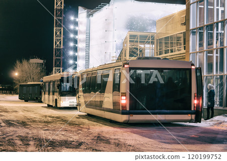 Airport buses near the terminal at night 120199752