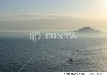 Scenery seen from the Atsumi Peninsula: Kamishima Island shrouded in mist and a sailing ship Scenery seen from the Atsumi Peninsula: Kamishima Island shrouded in mist and a sailing ship 120200459