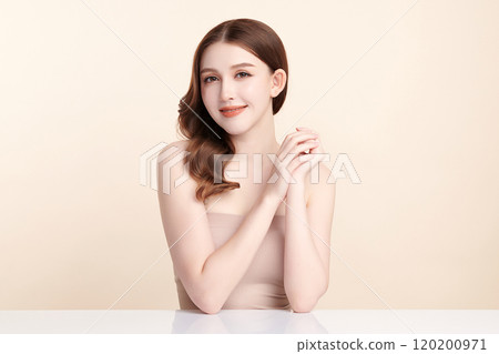 Beautiful young asian woman with clean fresh skin on beige background, Face care, Facial treatment, Cosmetology, beauty and spa, Asian women portrait. Beautiful young asian woman with clean fresh skin on beige background, Face care, Facial treatment, Cosmetology, beauty and spa, Asian women portrait. 120200971