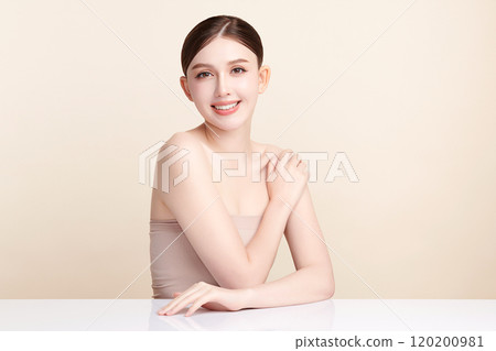 Beautiful young asian woman with clean fresh skin on beige background, Face care, Facial treatment, Cosmetology, beauty and spa, Asian women portrait. 120200981