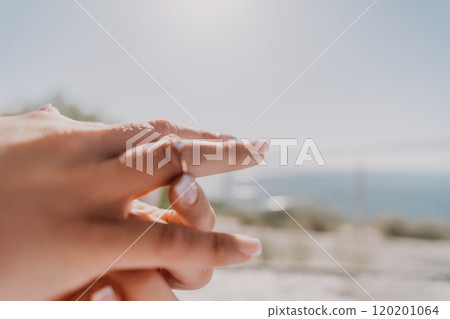 Closeup of a Hand With a Diamond Ring Closeup of a Hand With a Diamond Ring 120201064