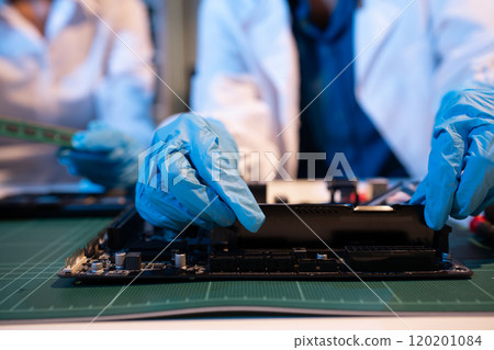 Close up of Technician measuring voltage electronic circuit board, Service after sale fix electric equipment. Close up of Technician measuring voltage electronic circuit board, Service after sale fix electric equipment. 120201084