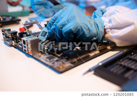 Close up of Technician measuring voltage electronic circuit board, Service after sale fix electric equipment. Close up of Technician measuring voltage electronic circuit board, Service after sale fix electric equipment. 120201085
