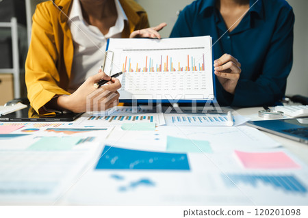 financial asian advisor showing plan of investment to clients in the consultancy office. financial asian advisor showing plan of investment to clients in the consultancy office. 120201098