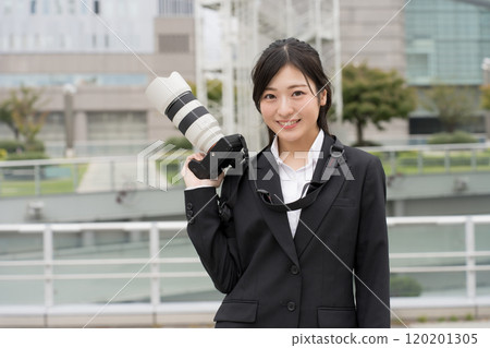 Female photographer in a suit Female photographer in a suit 120201305