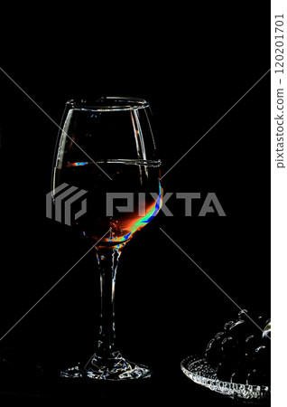Wineglass with red wine on a black background in the dark. Illustration. Wineglass with red wine on a black background in the dark. Illustration. 120201701