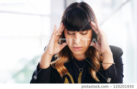 The battle of burnout. Shot of a young businesswoman experiencing stress while working in a modern office. The battle of burnout. Shot of a young businesswoman experiencing stress while working in a modern office. 120201930