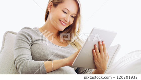Some of these pregnancy blogs are really funny. Shot of a pregnant woman using a tablet at home. 120201932