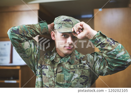In a world where you can be anything, be brave. Shot of a young soldier standing getting dressed in the dorms of a military academy. 120202105