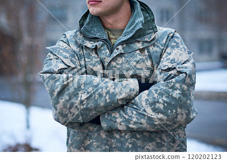 Courage is a soldiers greatest armor. Cropped shot of a young soldier standing outside on a snowy day at military school. Courage is a soldiers greatest armor. Cropped shot of a young soldier standing outside on a snowy day at military school. 120202123