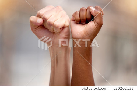 Standing together in support. Shot of two people protesting together in solidarity. Standing together in support. Shot of two people protesting together in solidarity. 120202135
