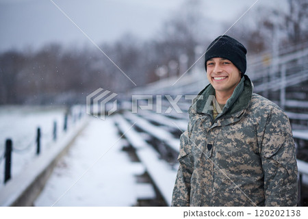 Whatever the weather I will defend my country. Shot of a young soldier standing outside on a snowy day at military school. Whatever the weather I will defend my country. Shot of a young soldier standing outside on a snowy day at military school. 120202138