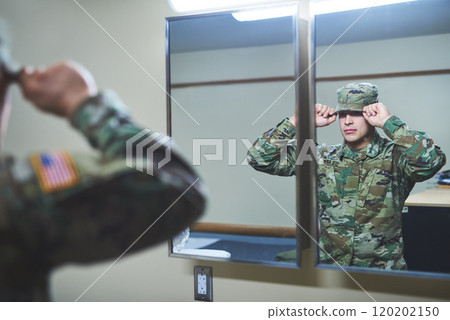 The battlefield is calling and I must go. Shot of a young soldier standing getting dressed in the dorms of a military academy. The battlefield is calling and I must go. Shot of a young soldier standing getting dressed in the dorms of a military academy. 120202150
