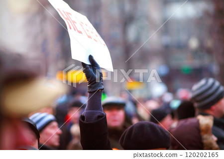 We stand united. Rear view shot of a group of protesters. We stand united. Rear view shot of a group of protesters. 120202165