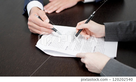 Businesswoman checking a contract 120202540