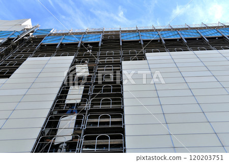 Large-scale repair work site: Temporary soundproofing panels being assembled 120203751