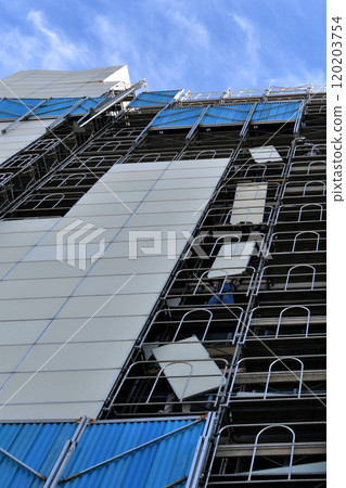 Large-scale repair work site: Temporary soundproofing panels being assembled 120203754