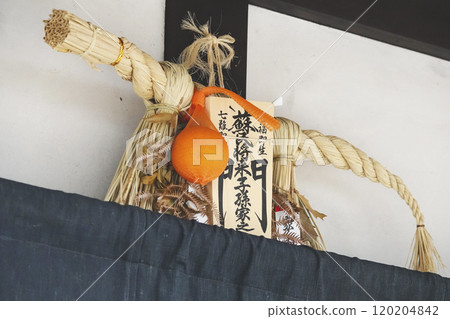 New Year decorations (Shomon) displayed on the eaves of an old house in the castle town New Year decorations (Shomon) displayed on the eaves of an old house in the castle town 120204842