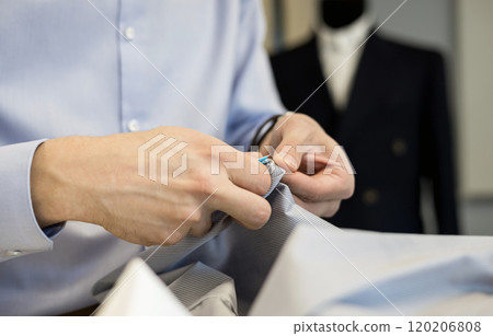 close-up of the tailor's hands 120206808