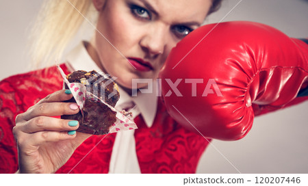 Woman boxing chocolate cupcake 120207446