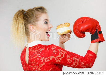 Woman boxing cream cupcake 120207448